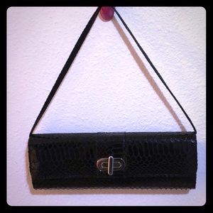 Black clutch with strap